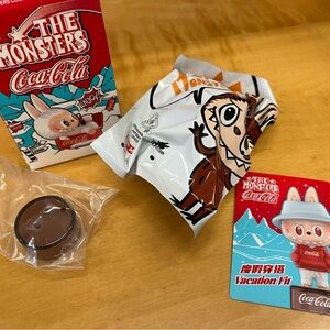The Monsters x Coca Cola Labubu “Vacation Fit” blind box figure
